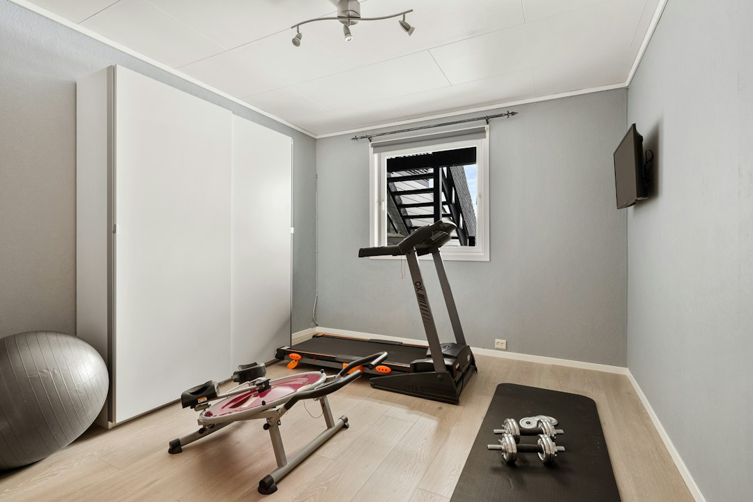 Tips for Using Home Exercise Equipment cover illustration of a family-friendly home gym